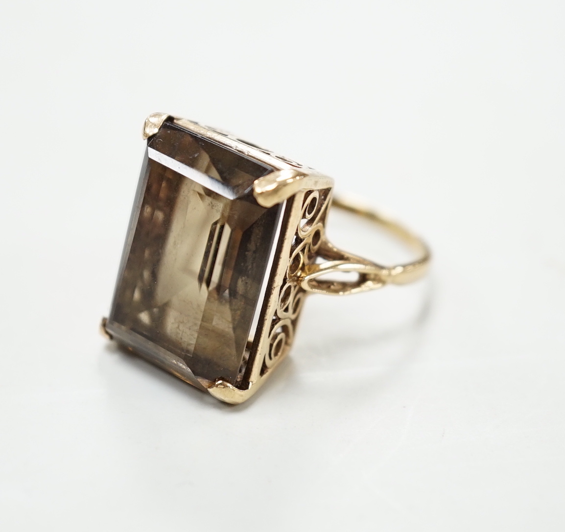 A 9ct gold and single stone smoky quartz set dress ring, size T, gross weight 8.5 grams.